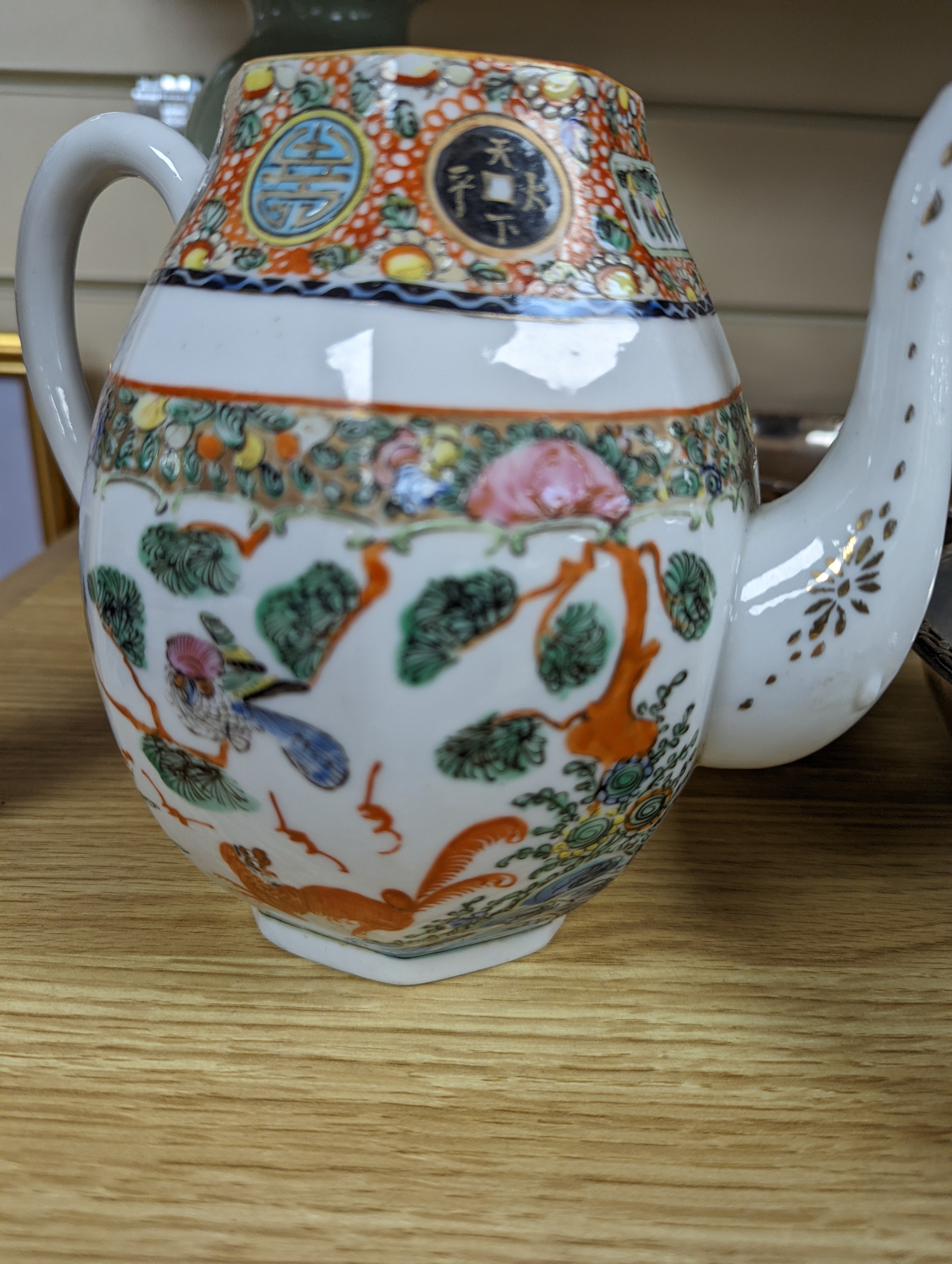 A Chinese celadon glazed vase, 24cm and a Chinese famille rose teapot and matching cream jug, a.f.